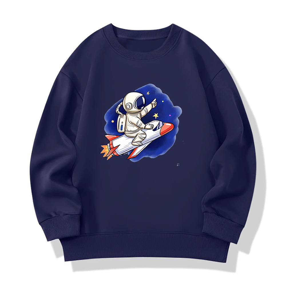 Kids astronaut graphic sweatshirt featuring a whimsical design of an astronaut on a rocket, surrounded by stars. Perfect for space lovers.
